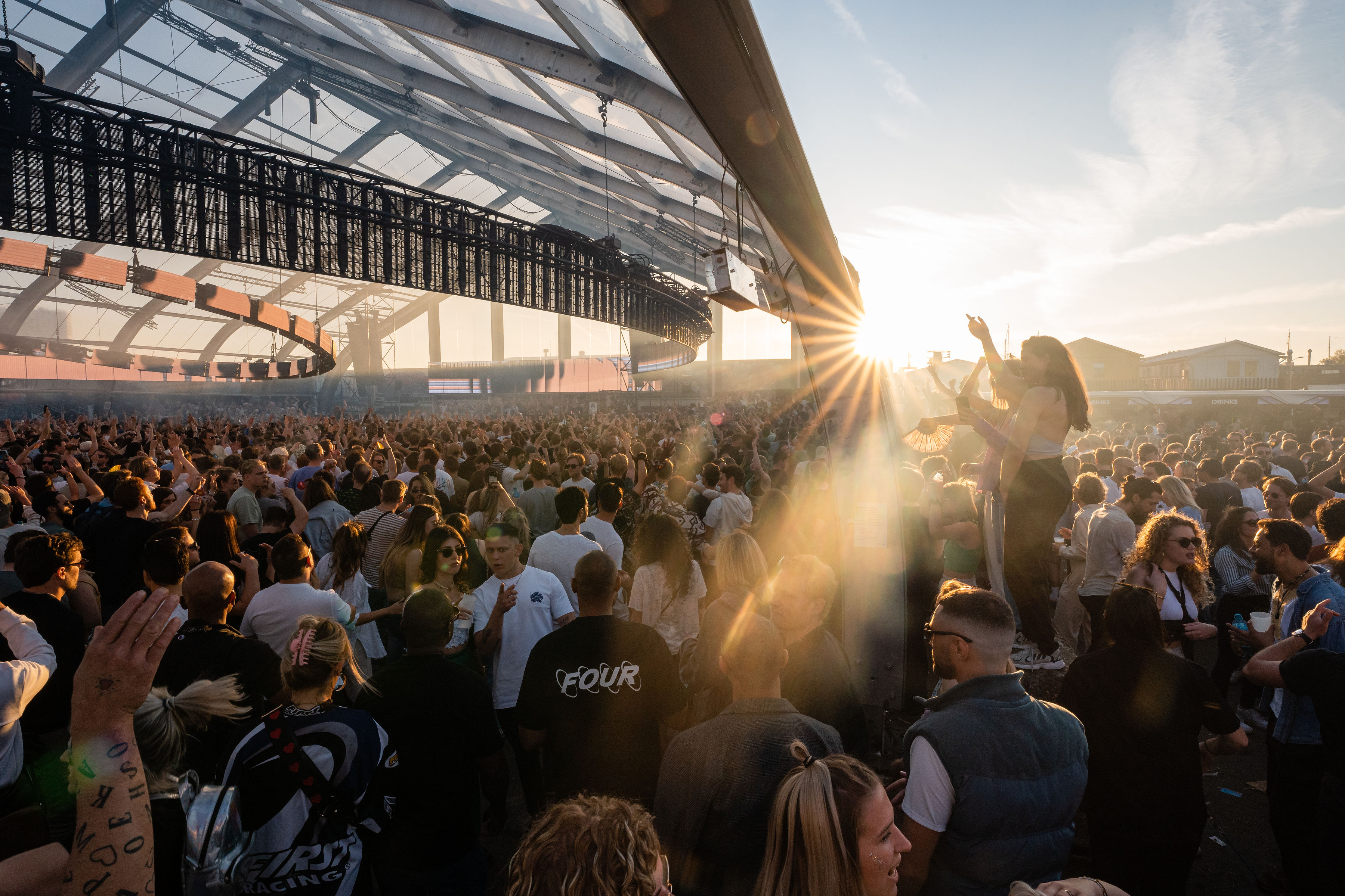 Crowd at DGTL Amsterdam in the sunset light